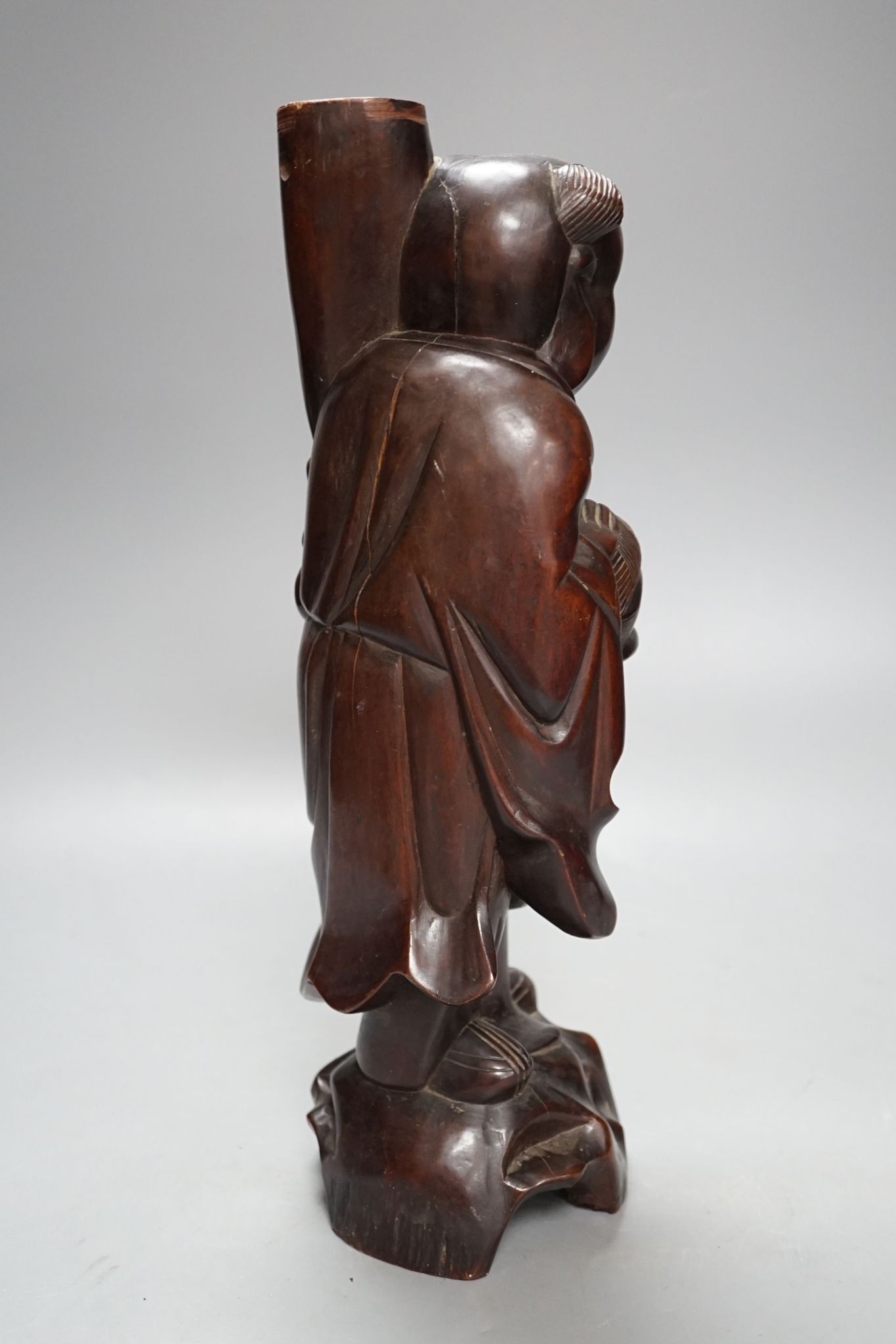 A Chinese hardwood figure of an immortal, 36cm